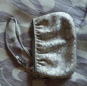 White/silver Coach Wristlet